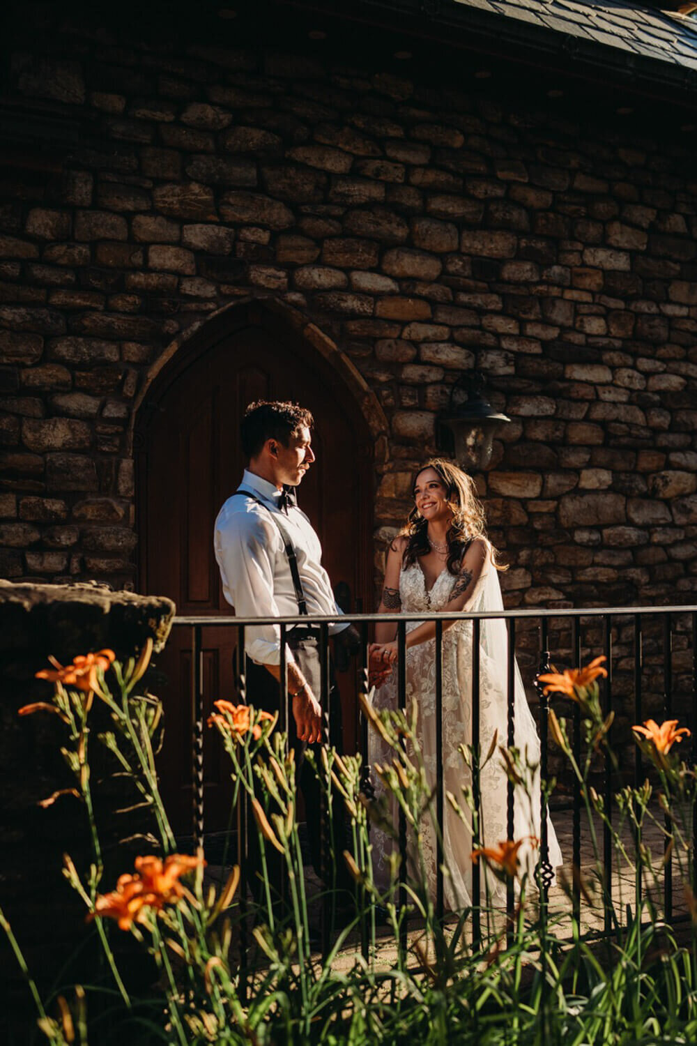 Couple stand against castle in Ohio