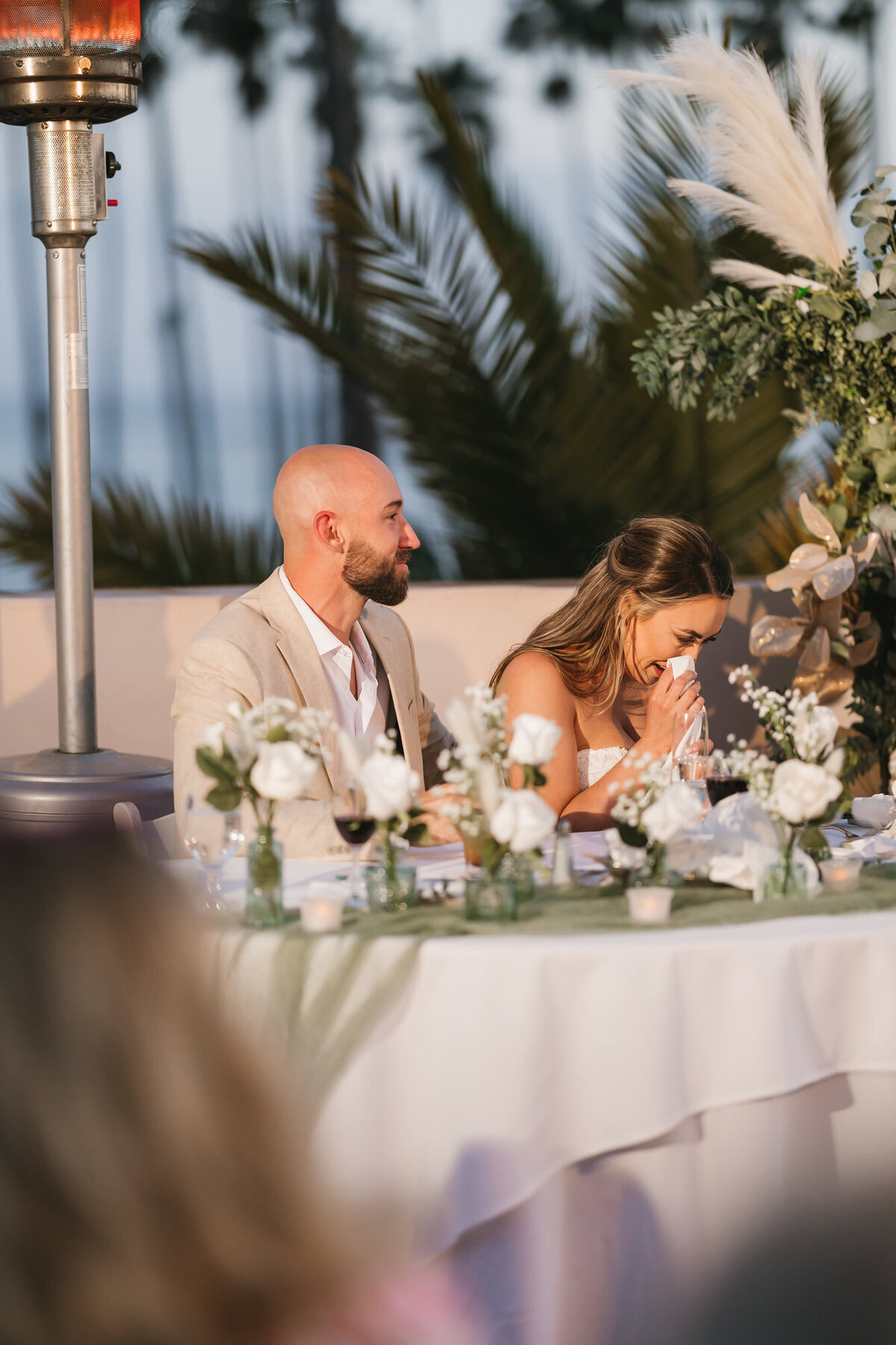 Bride crying during maid of honor speech at Hilton Beachfront Resort Santa Barbara