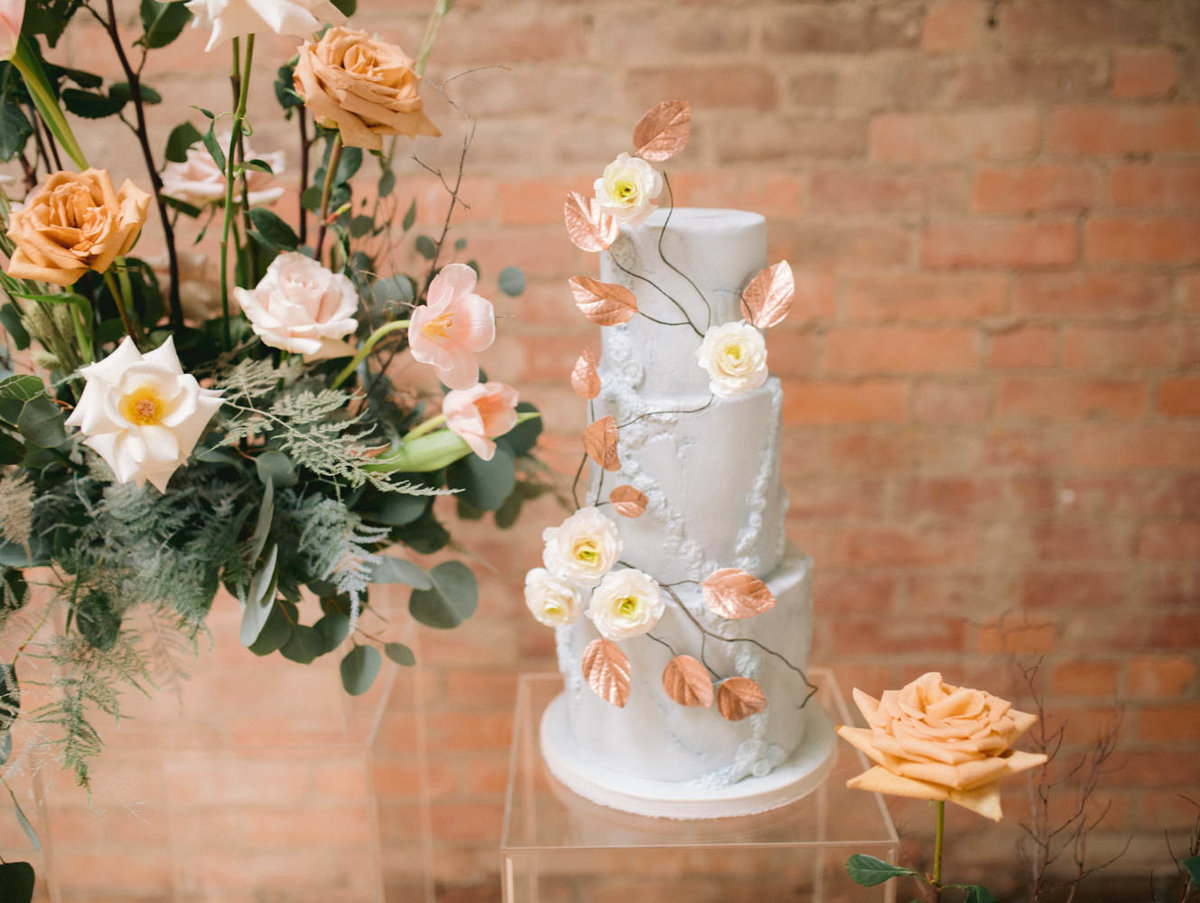 vintage aged stone wedding cake with romantic sugar flowers
