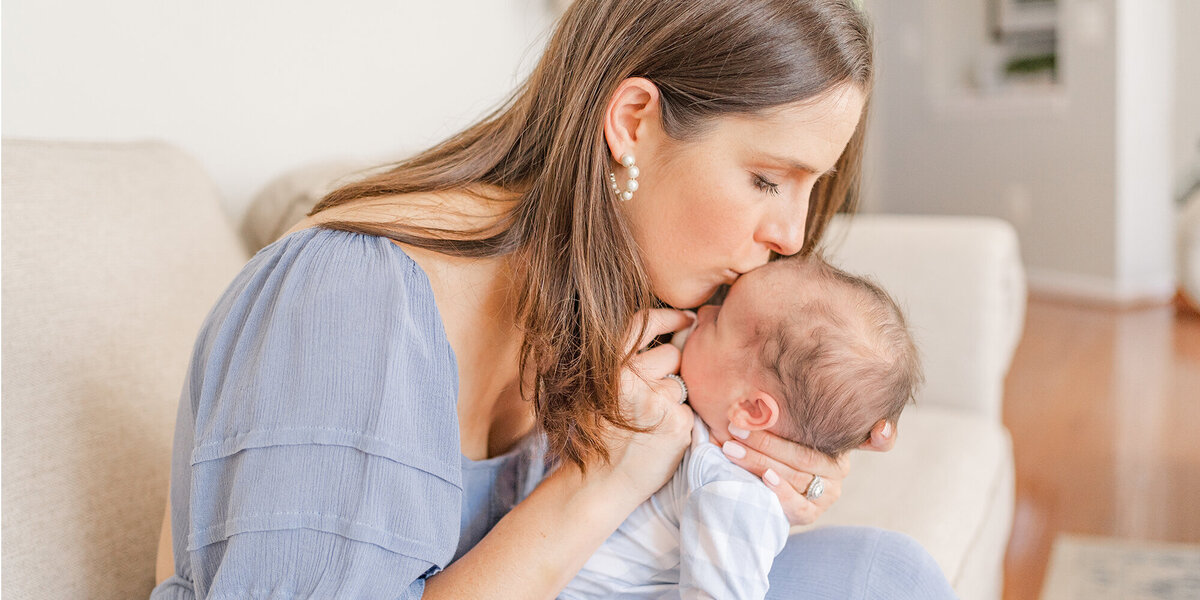 mom kissing baby during a family session in Fairfax County, VA taken by a Northern Virginia family photographer
