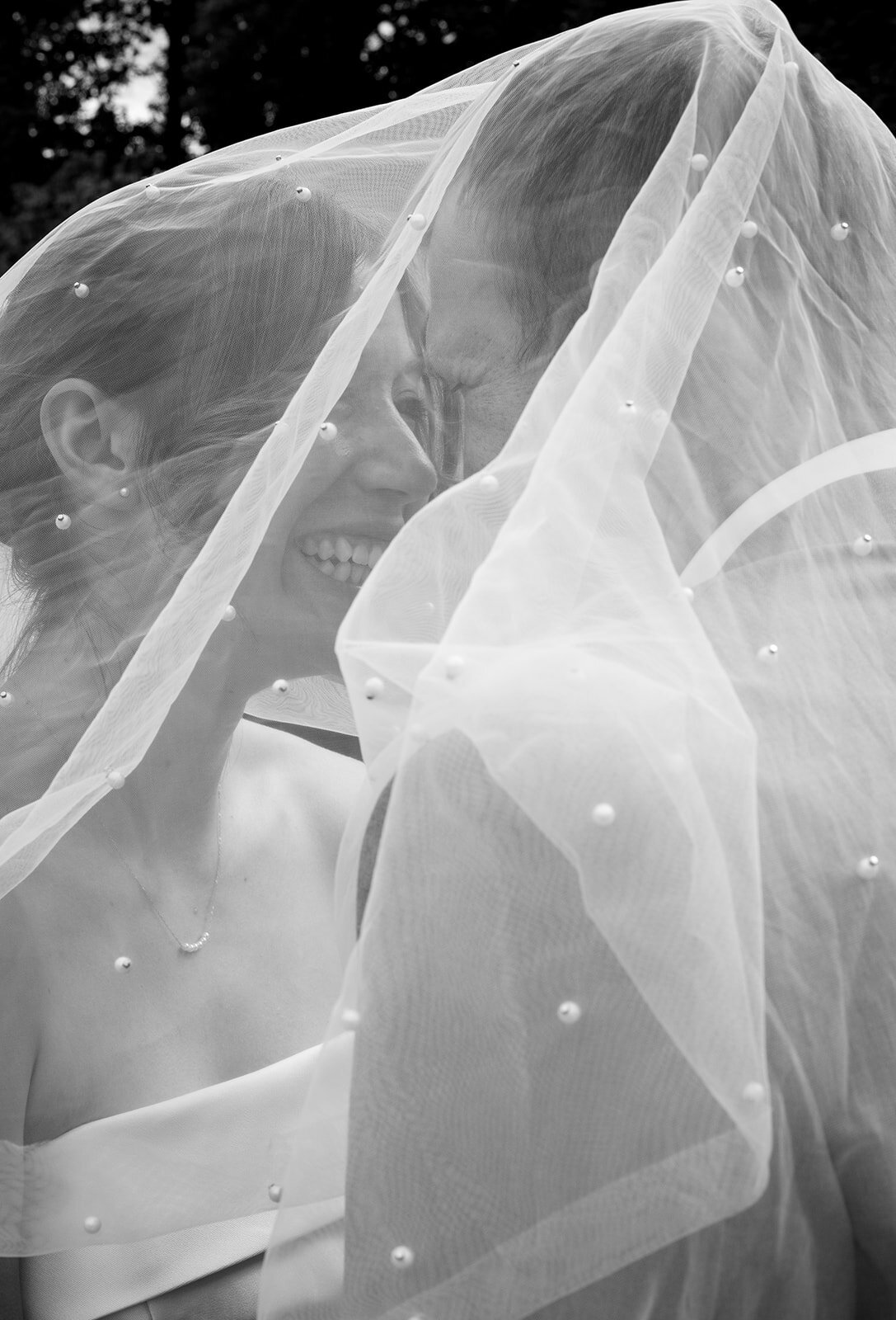 northwest-arkansas-wedding-photographer-bride-and-groom-under-veil