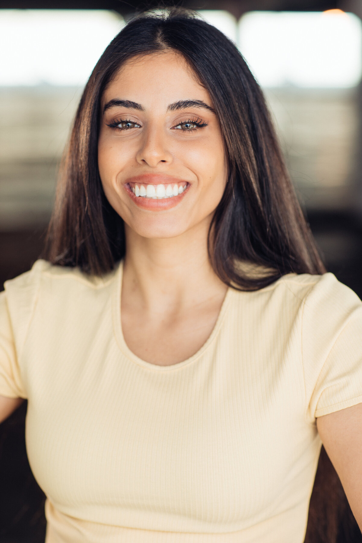 Headshot Photograph Of Young Woman In Light Yellow Shirt Los Angeles