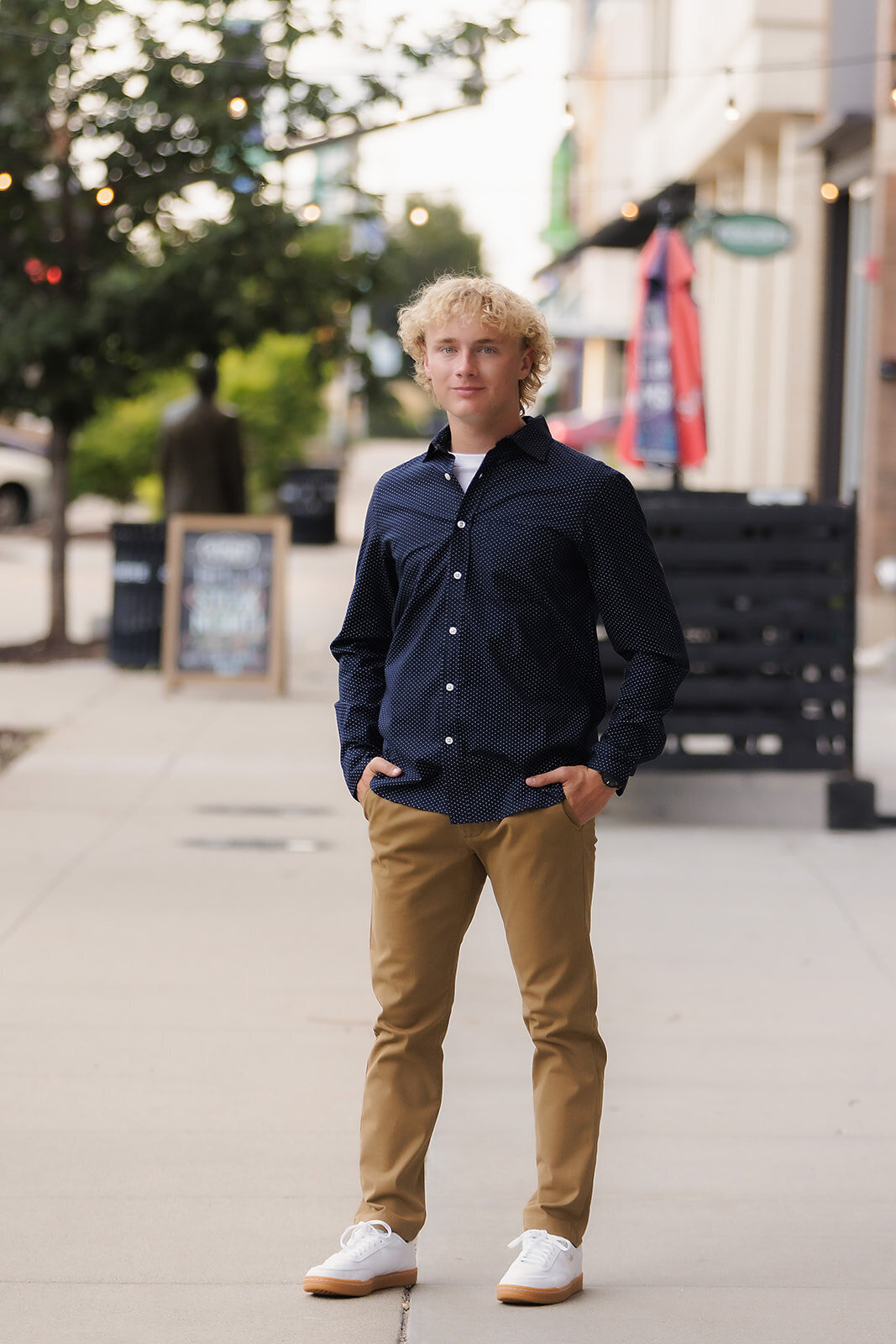 Boy outside of Brew Bank with hands in pockets
