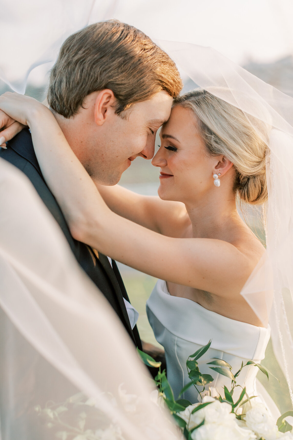 The veil encapsulates the newly married couple.