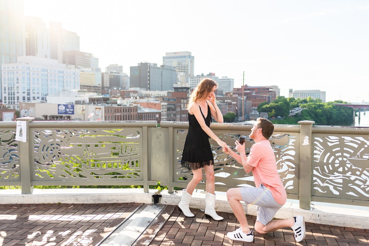 Surprise-proposal-photos-in-Downtown-Nashville-Pedestrian-Bridge+1