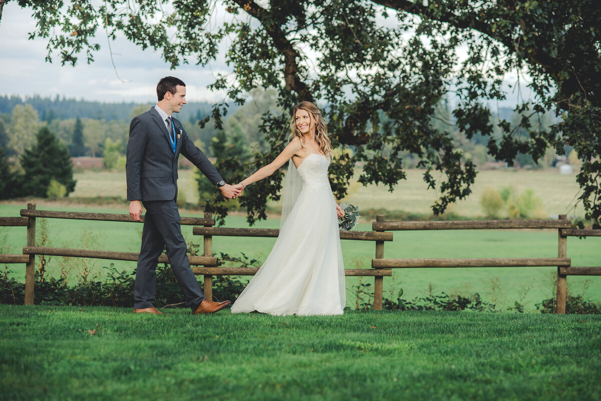 bride and groom walking in Oregon