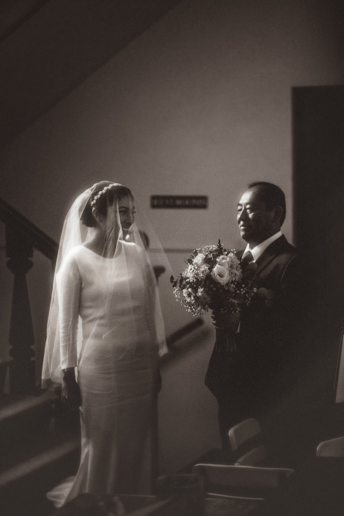 Wedding Photograph Of Father Giving Bouquet of Flowers To His Daughter Los Angeles