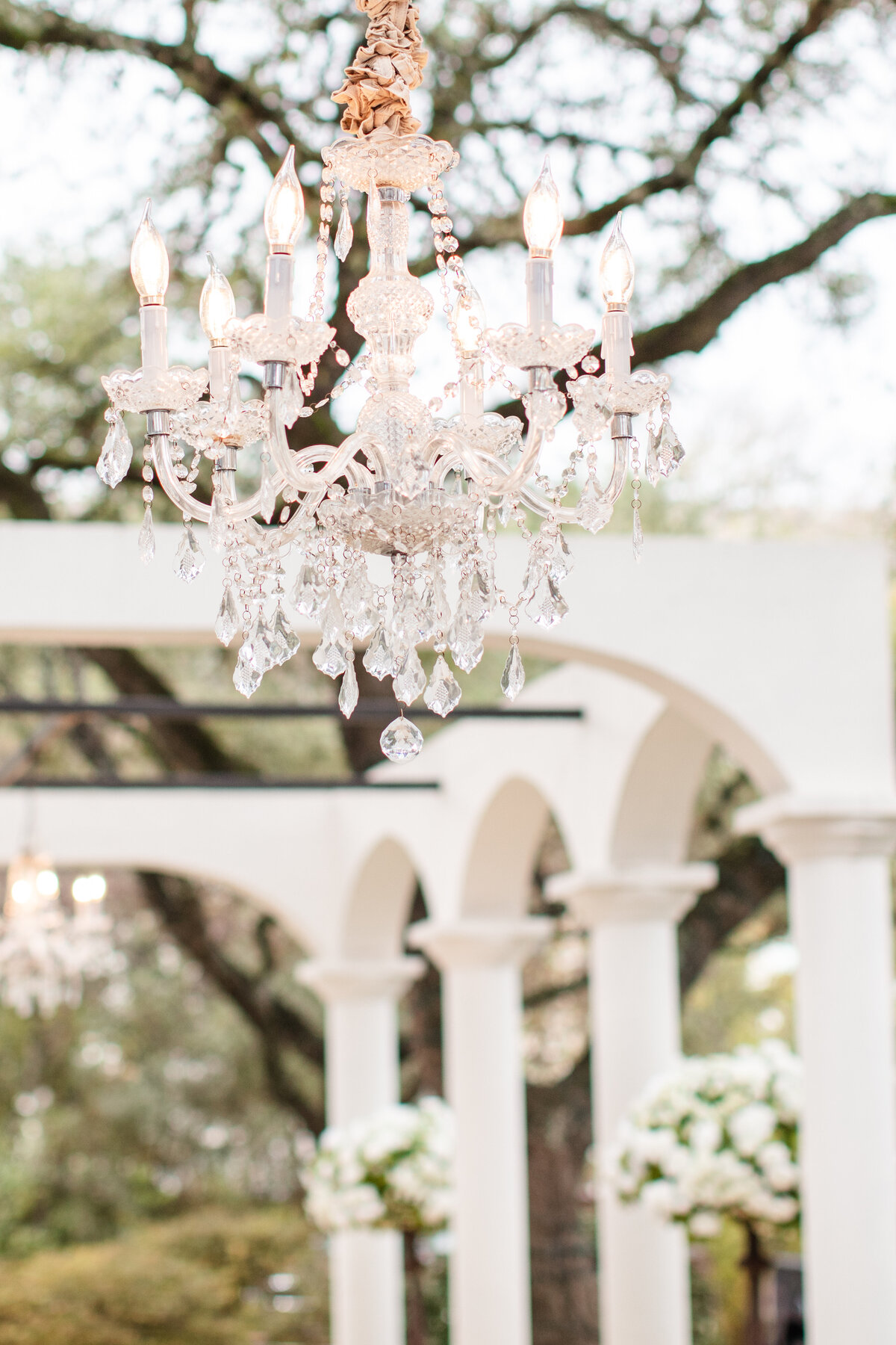 chandelier details at Gardens at West Green a Hill Country wedding venue by Firefly Photography