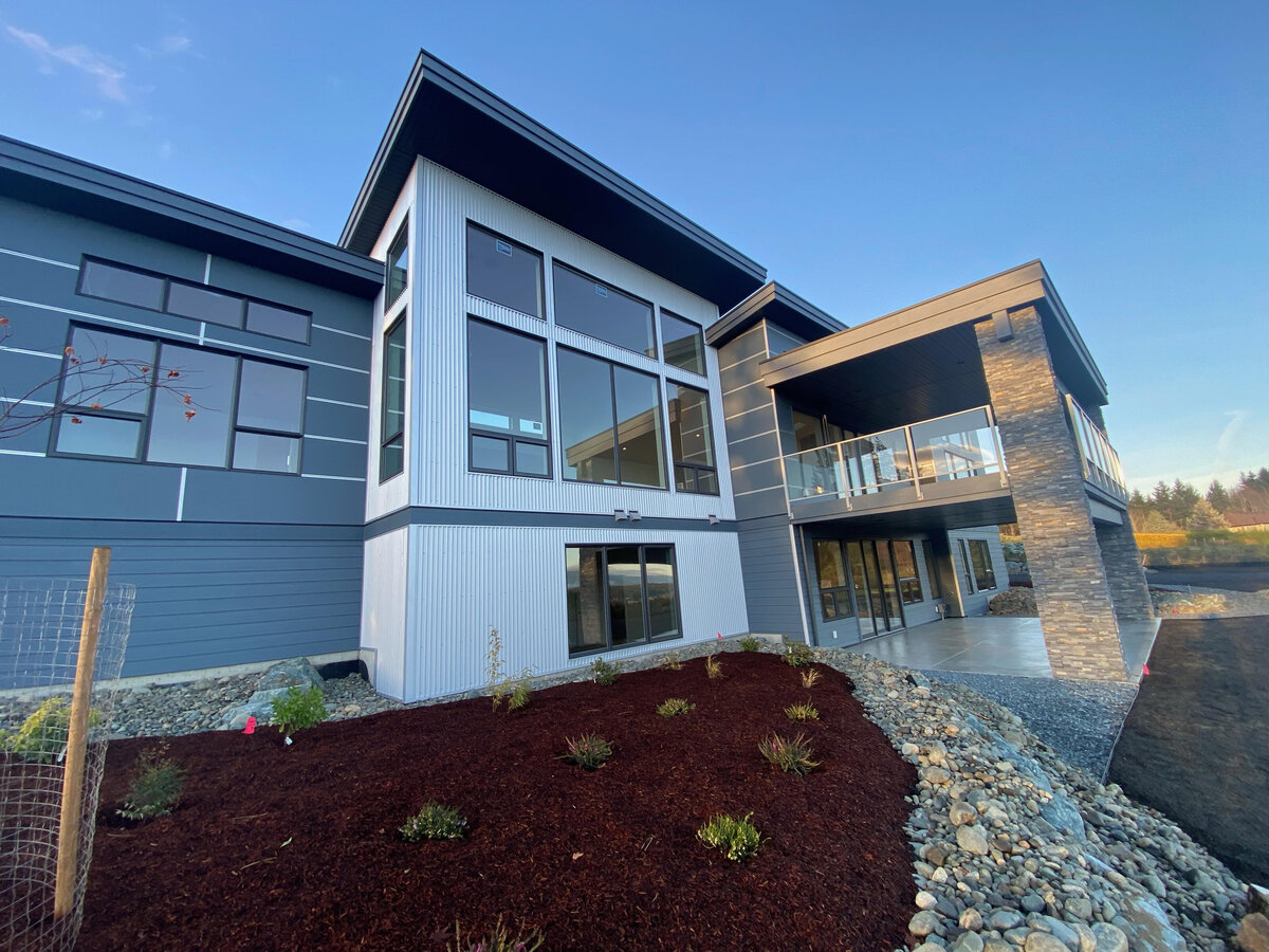 Modern home exterior design with corrugated steel paneling.