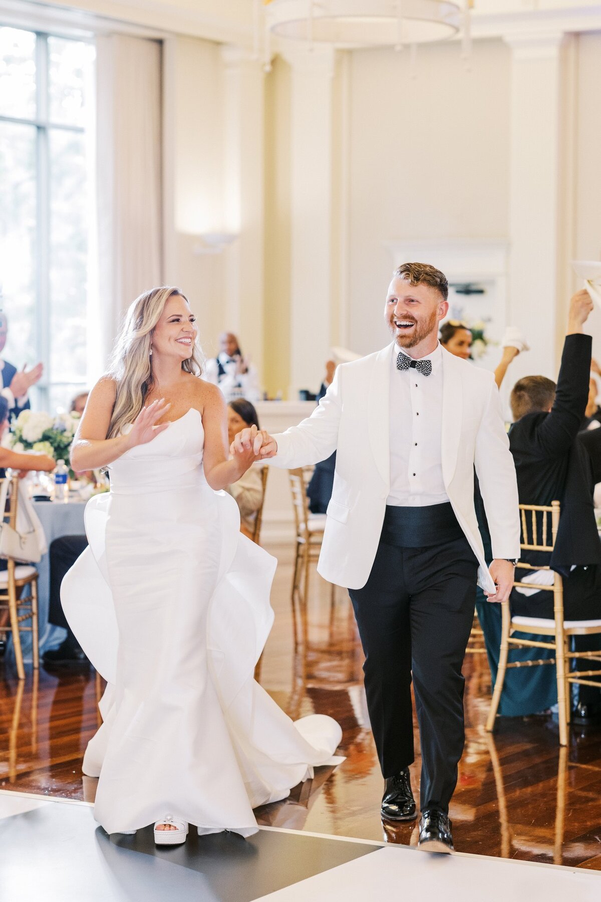 Wedding Couple walking onto the dance floor