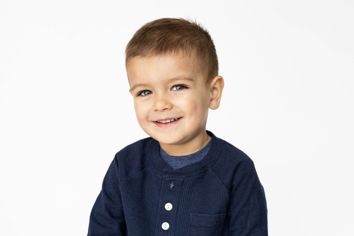 Bright and airy school photo with white backdrop