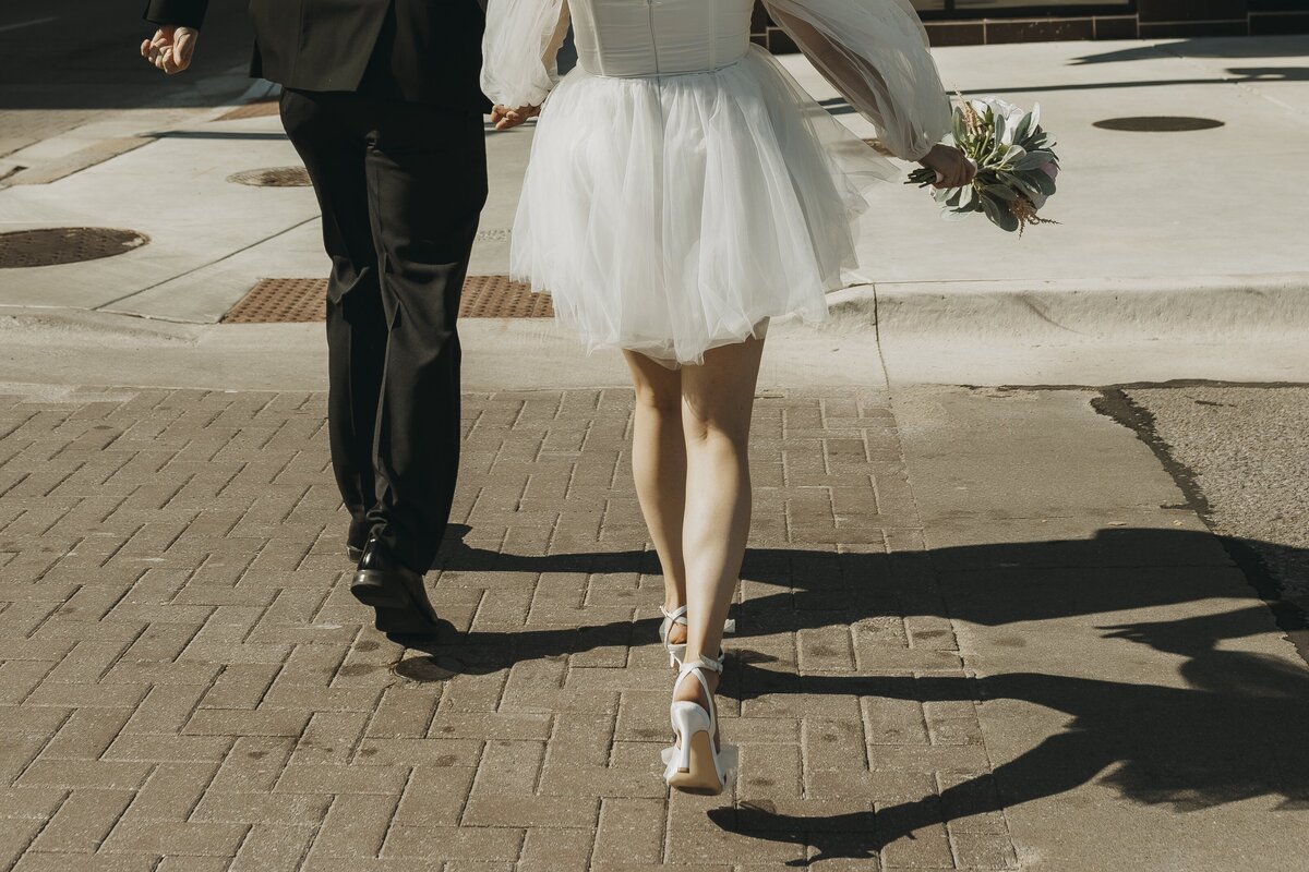 bride and groom shadow of hands of ground