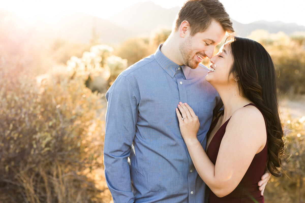 engaged couple posing together for engagement photo in Scottsdale desert