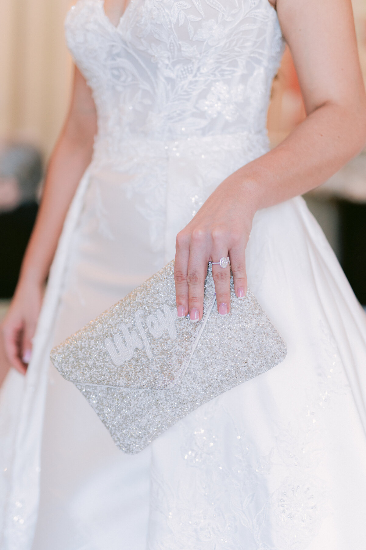 Bride holding clutch bag ready for wedding at the Olana in Dallas