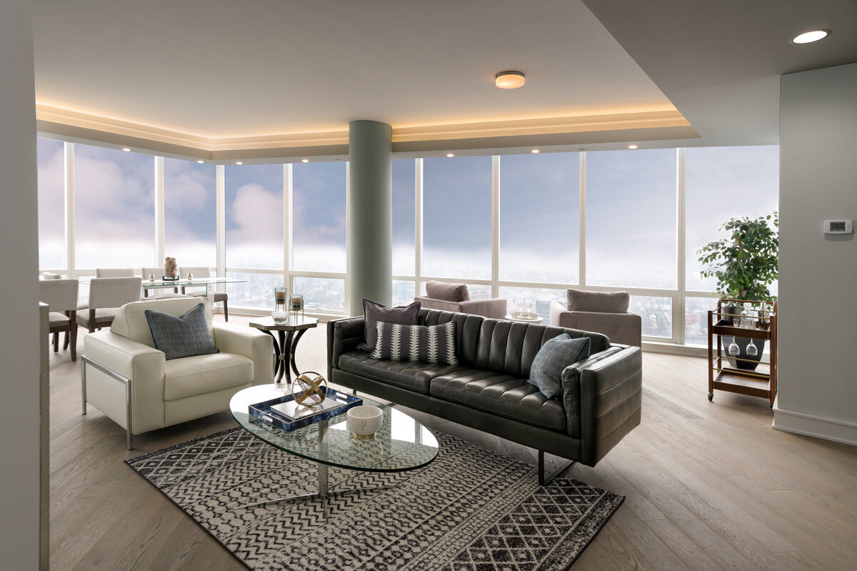 Living room with black sofa and white chair