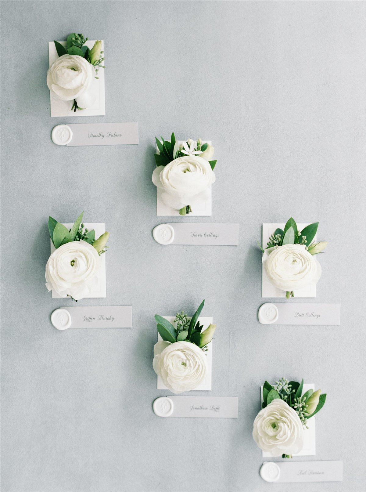 White ranunculus boutonnieres for groomsmenfor a Cape Cod Wedding by luxury Cape Cod wedding planner and designer Always Yours Events