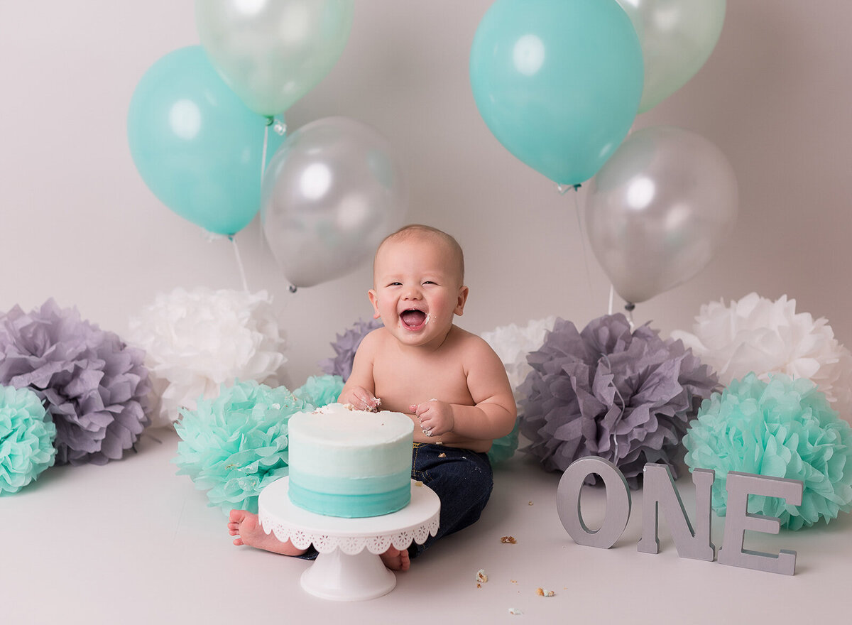 Silver and turquoise baby cake smash themed photography