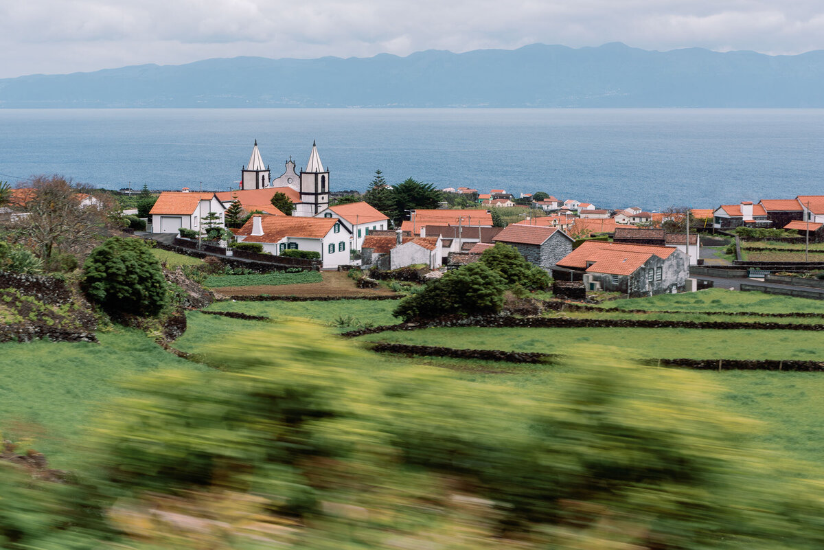 azroes portugal destination wedding church detail with ocean and mountain in the background
