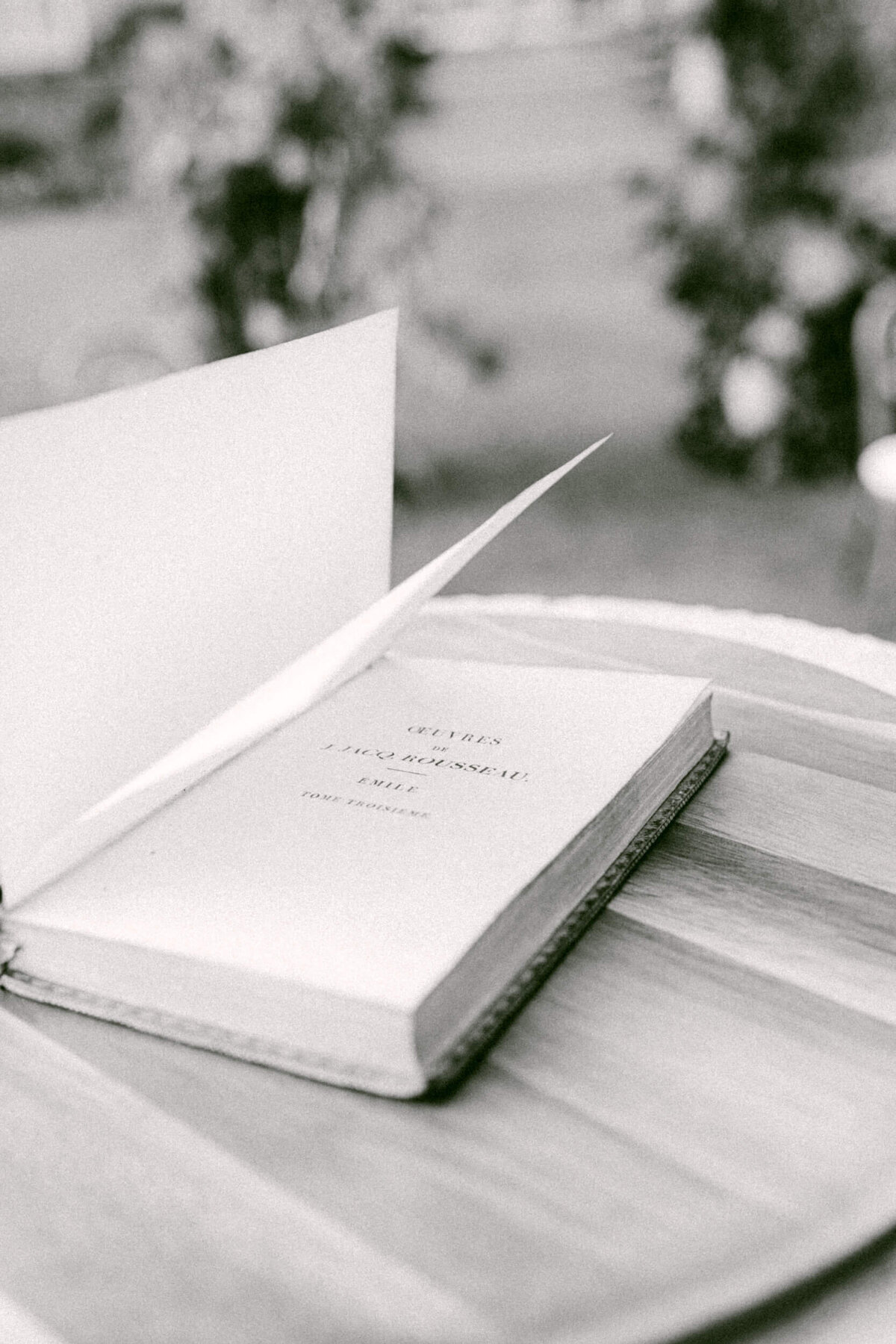 A black and white wedding photo of the vows book