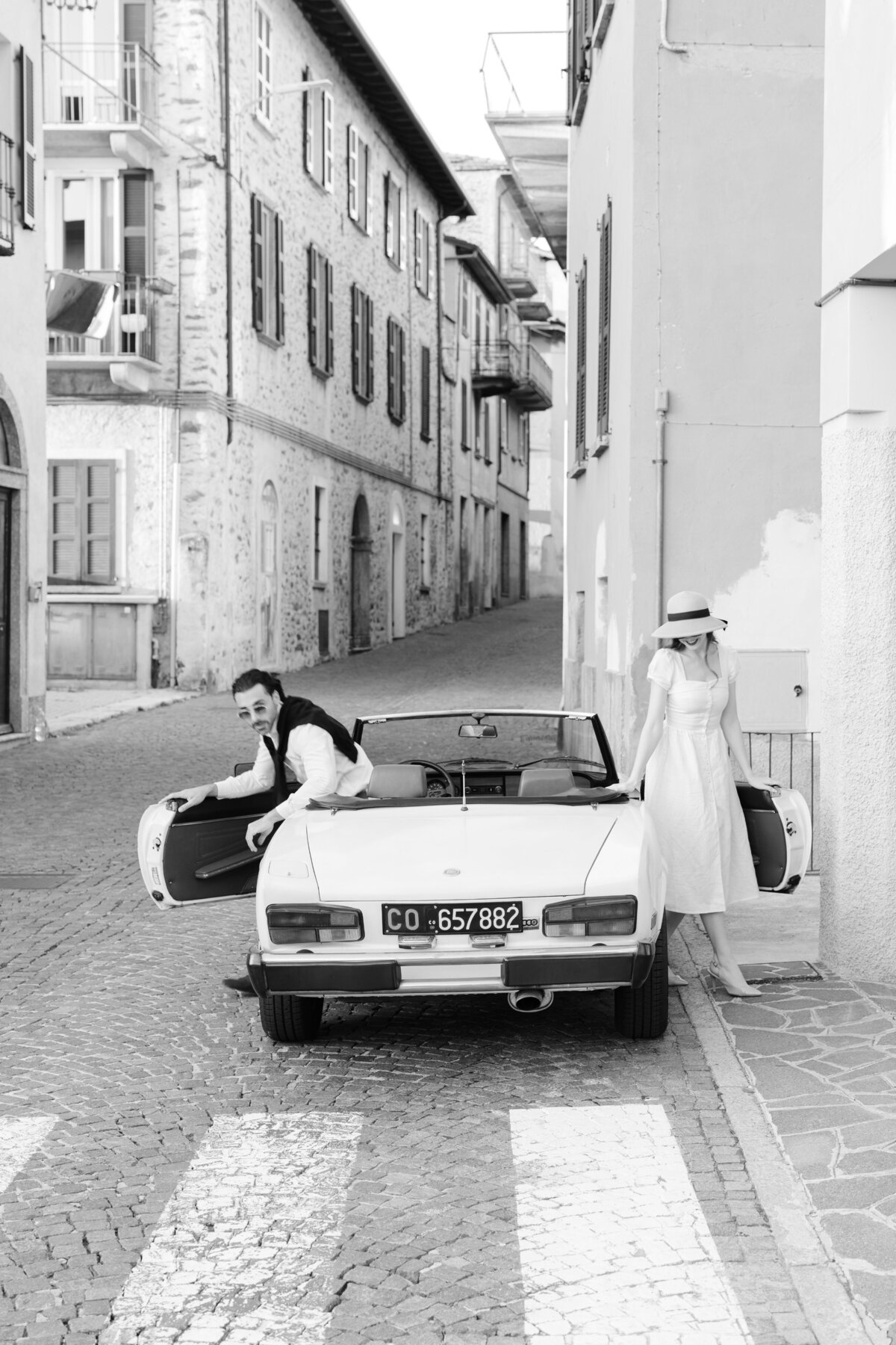 A classic engagement session in Lake Como Italy with a convertible car