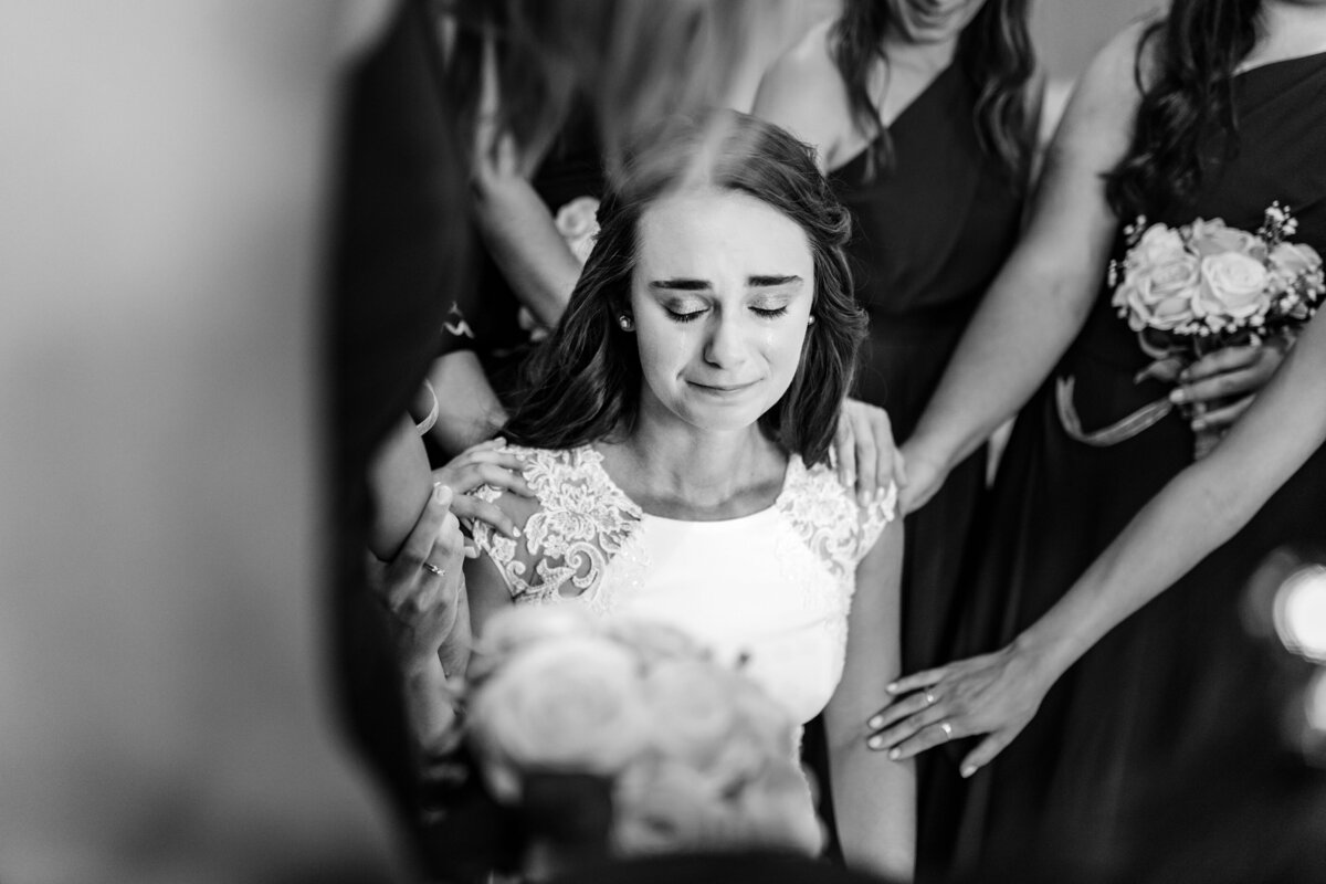Bride gets emotional during her wedding at Camp Lucy in Dripping Springs, Texas.