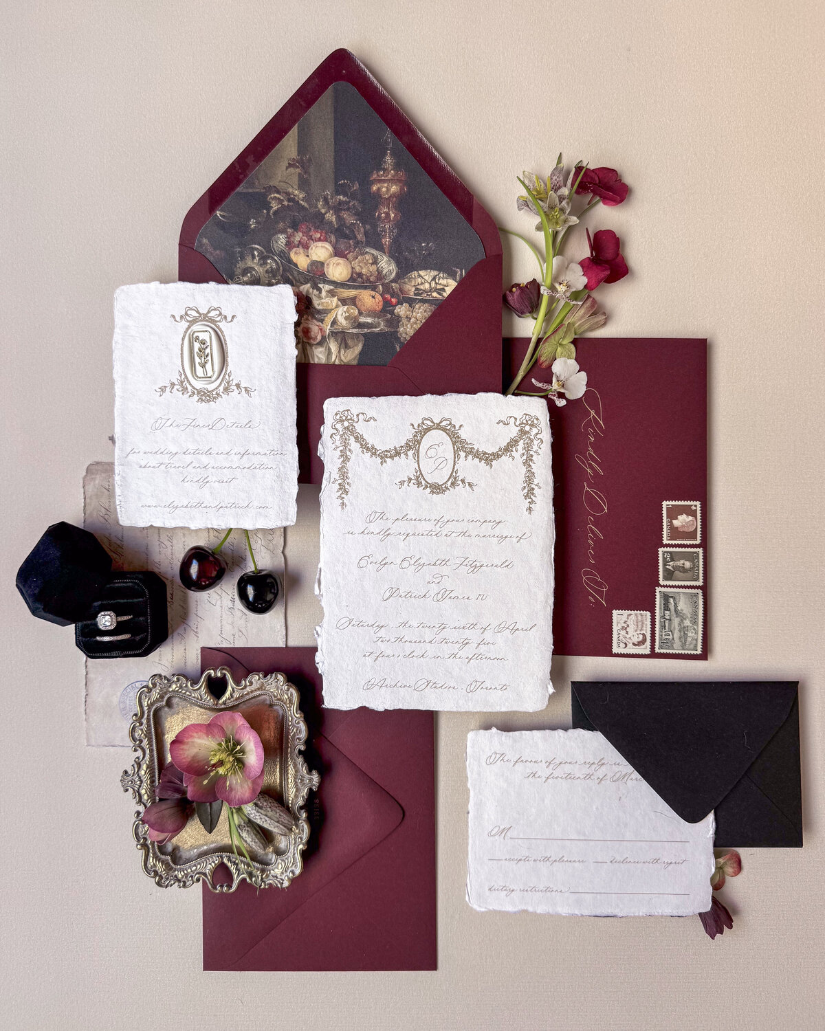 Handmade paper invitation suite styled with deckled edges with hand drawn garland crest