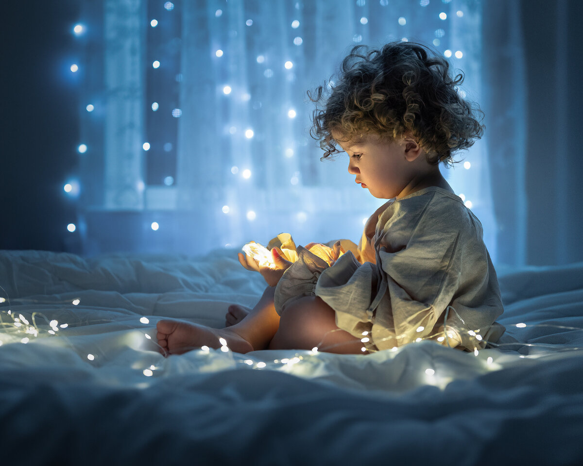 Child captivated by the magic of christmas lights. Cptured by Iya Estrellado Photography 