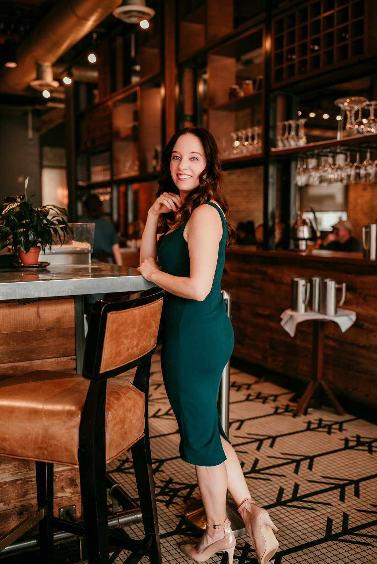 A professional dating portrait of a woman in downtown Minneapolis, with a stylish urban background.