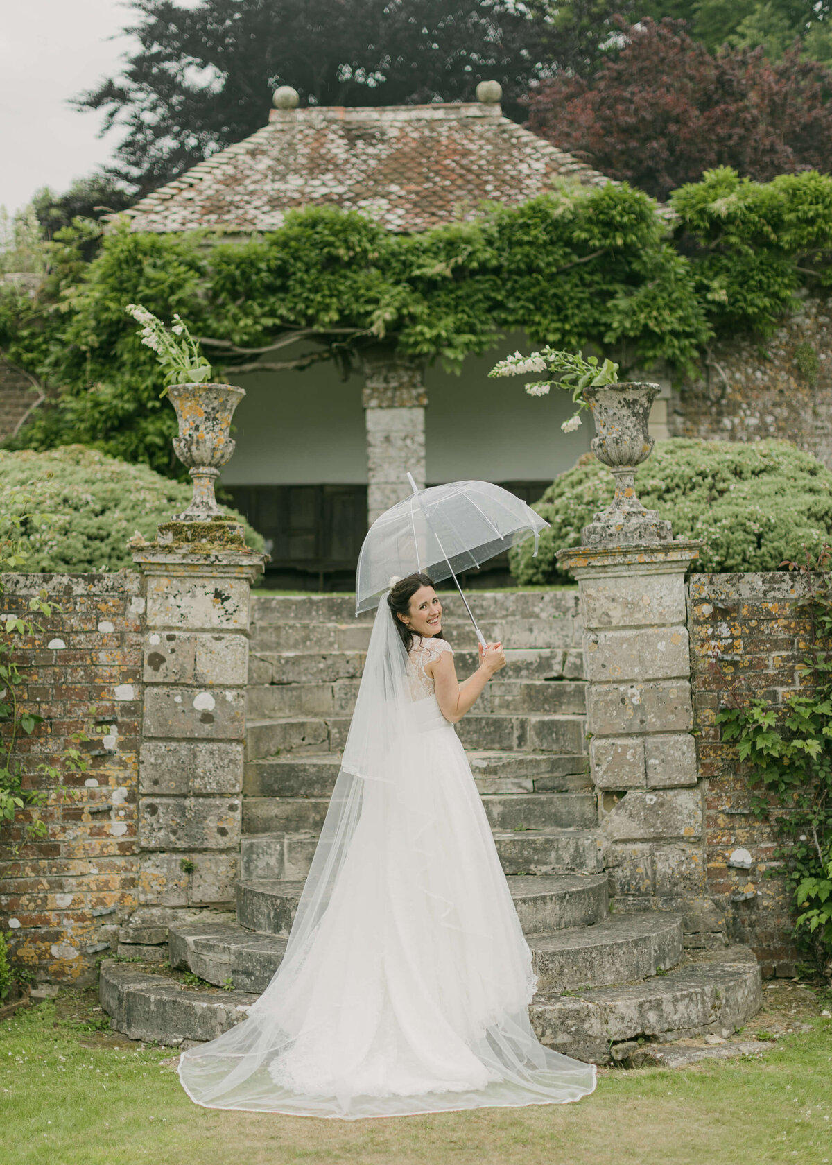 chloe-winstanley-weddings-wiltshire-hatch-house-garden-bride-umbrella