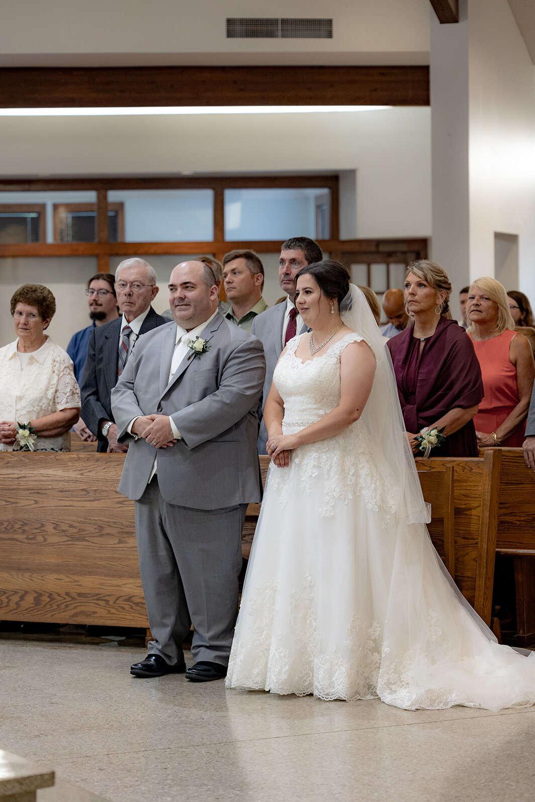 intimate-moment-bride-and-groom-during-mass