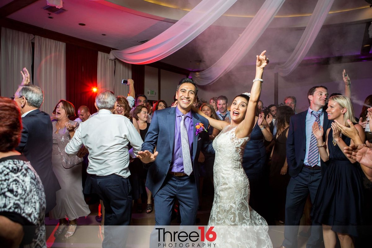 Bride and Groom dancing among their guests