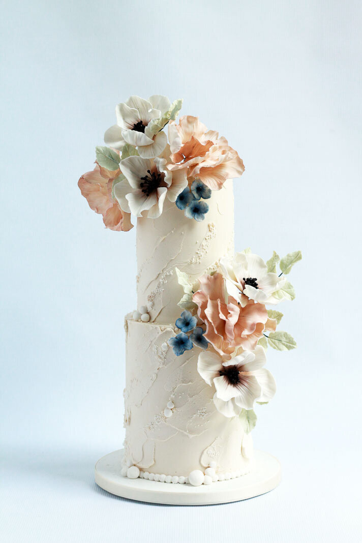 two tier textured buttercream wedding cake with flowers, Hamilton ON wedding cakes