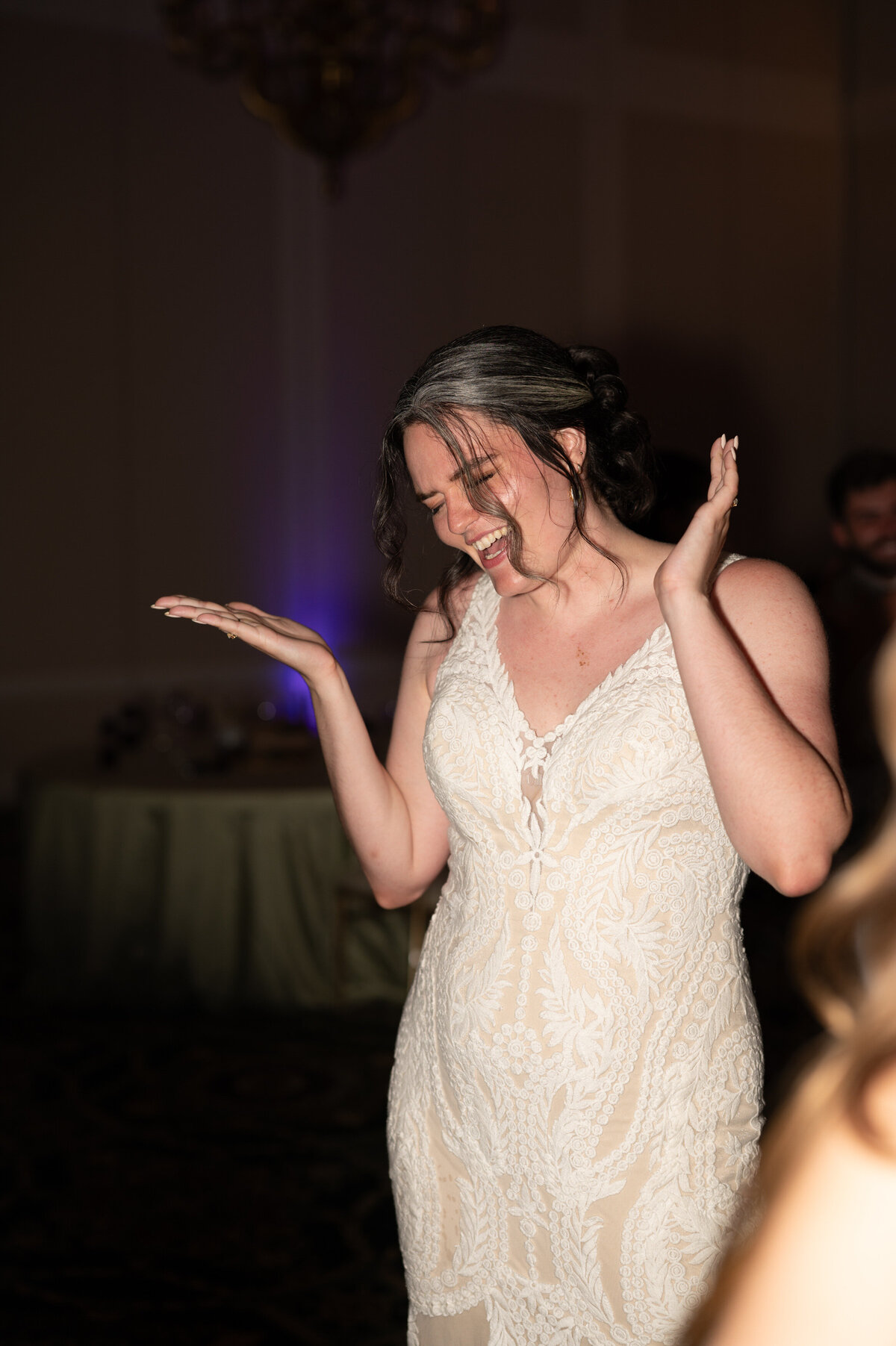 A bride dancing at their wedding reception