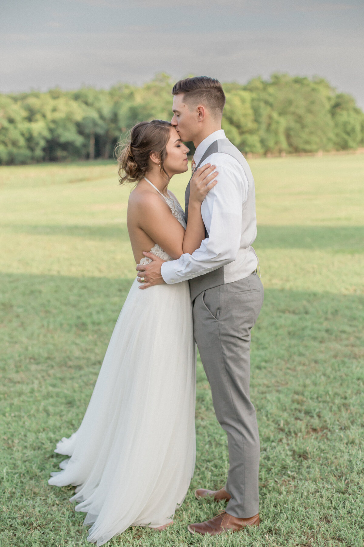 A newly married couple share an embrace after their Boulder wedding ceremony