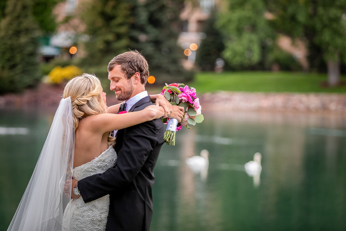 Bride and Groom at the Broadmoor with the lake in the background