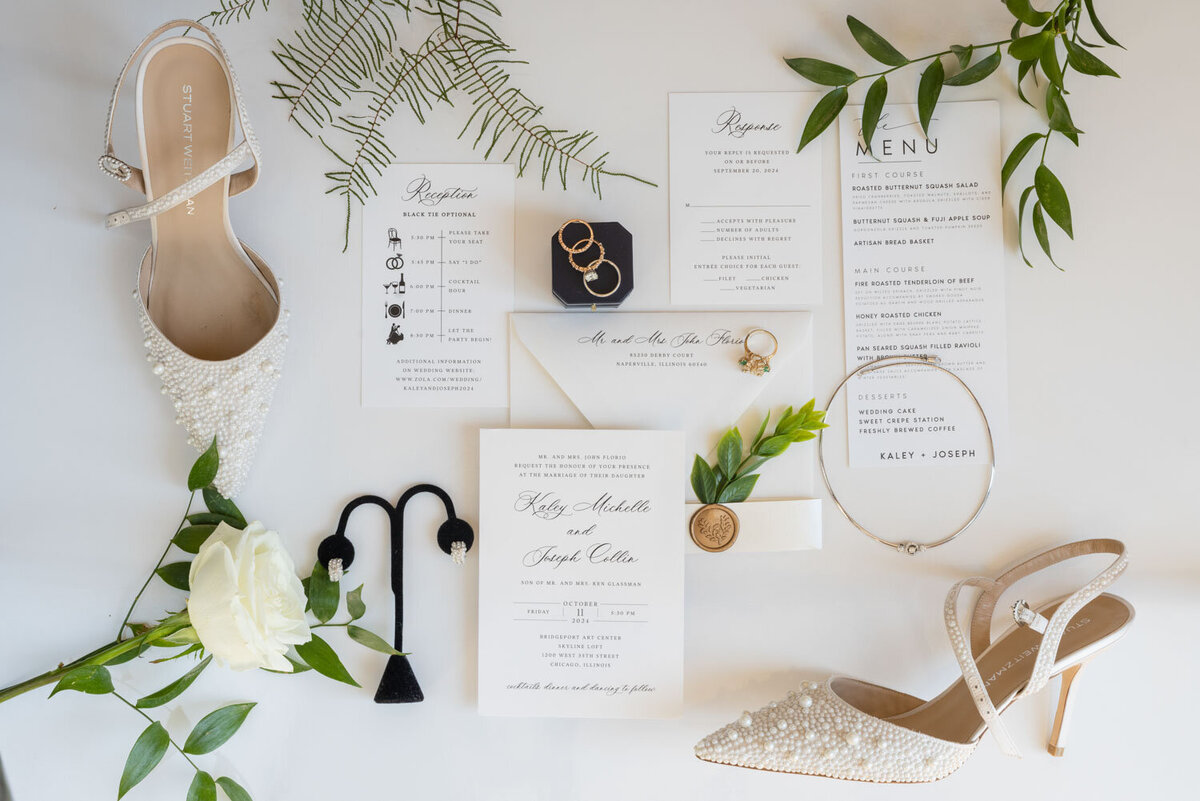A wedding invitation is laying on a table