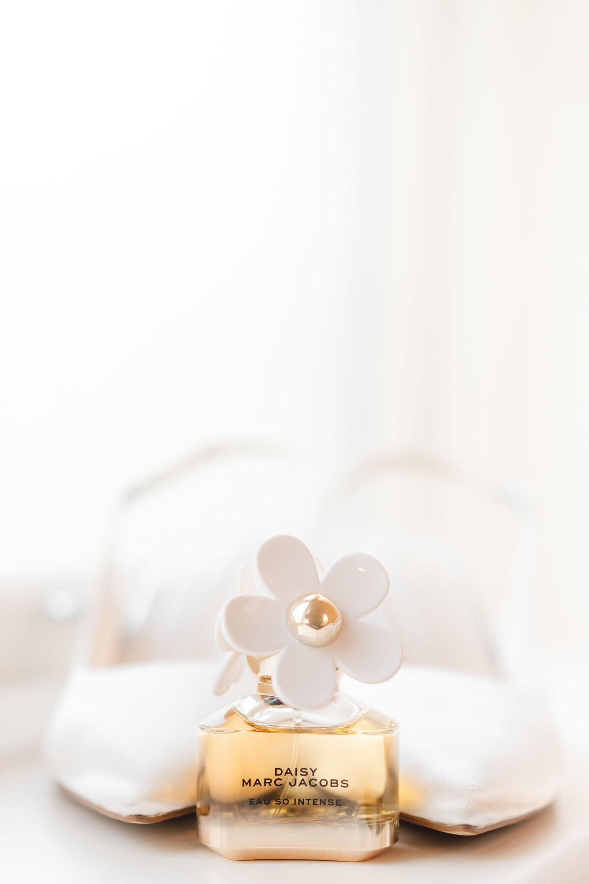 Wedding shoes and perfume by a light cheshire wedding photographer