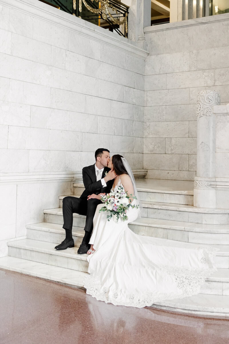 bride and groom kissing by minneapolis wedding photographer