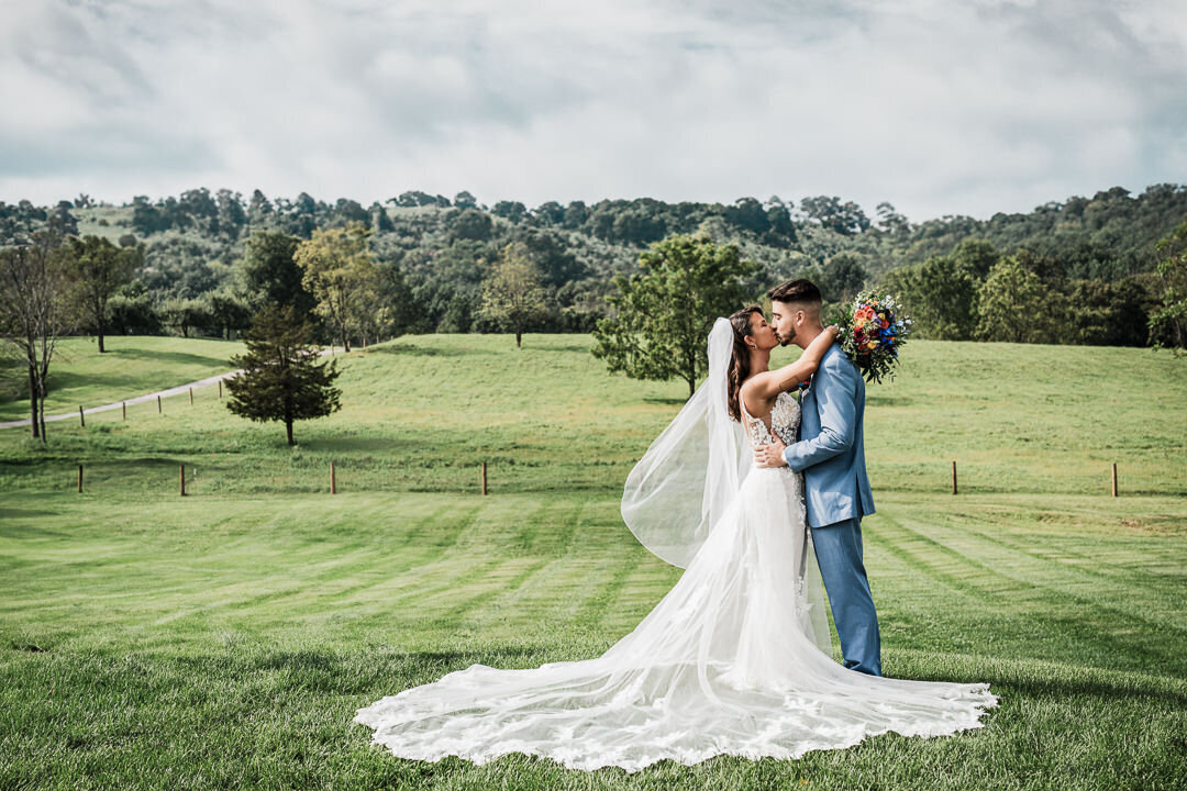 bride-groom-embrace-outdoor-summer-wedding-nj-by-alex-kaplan-photo