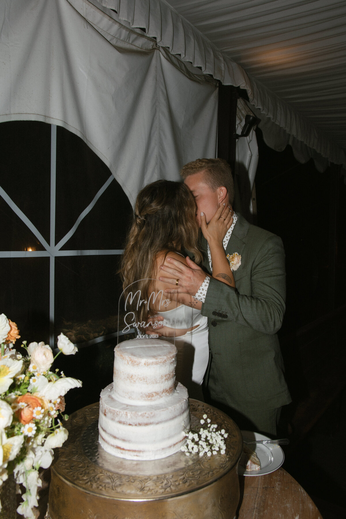 bride and groom cutting cake