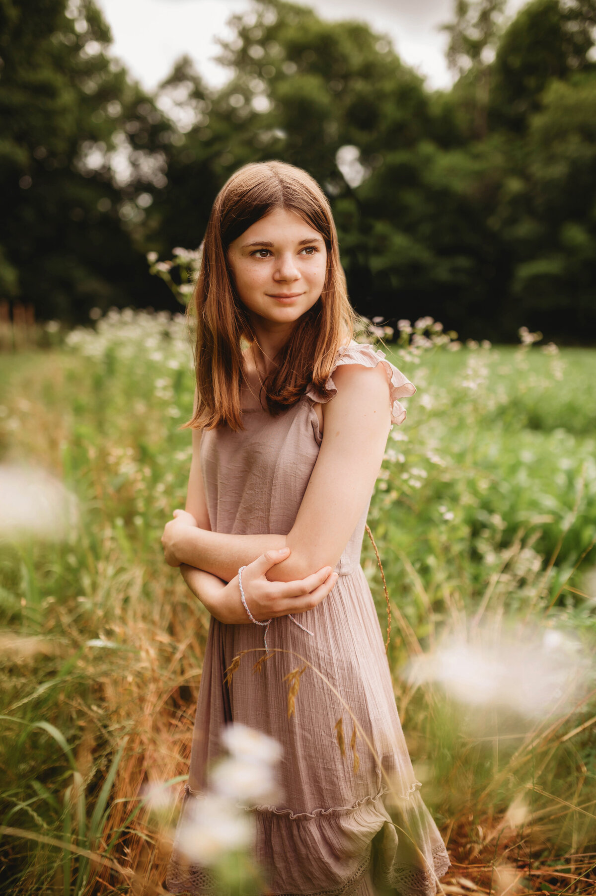 Child poses for Portraits during an Extended Family Photoshoot in Asheville, NC.