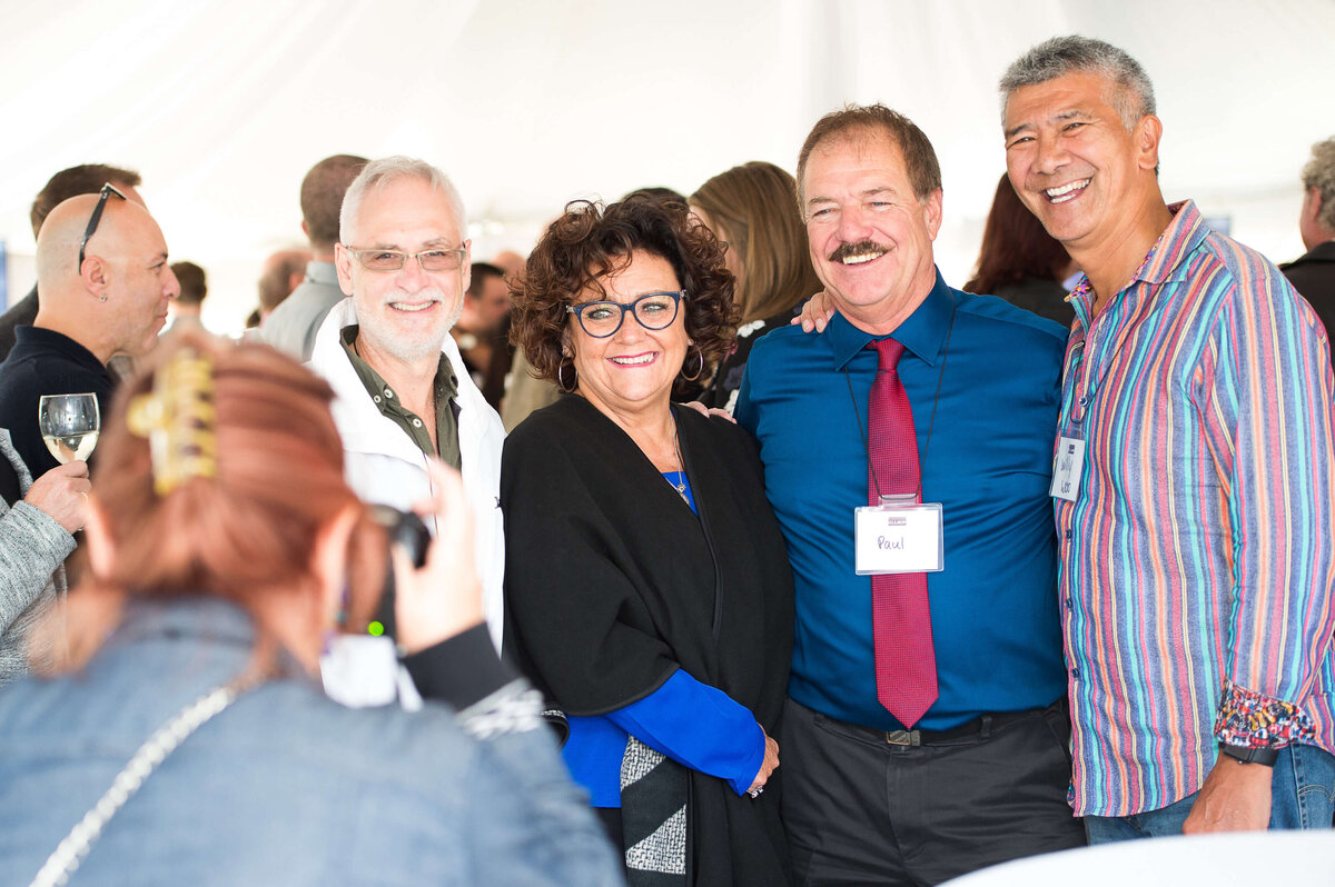 a photo of 4 smiling guests at Ell-Rod 25th Anniversary Celebration. Captured by Ottawa Event Photographer JEMMAN Photography COMMERCIAL   