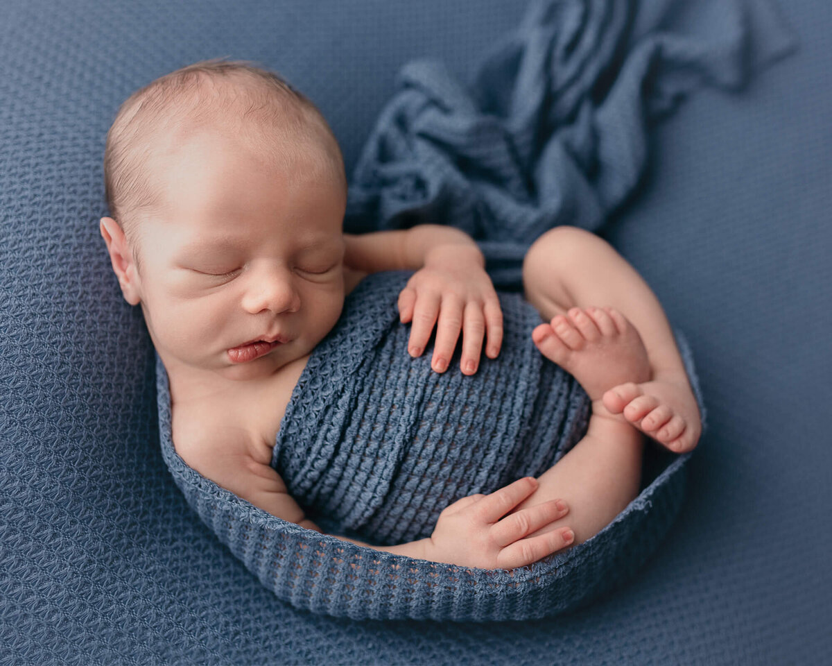 picture of baby in blue, Huck-Finn pose