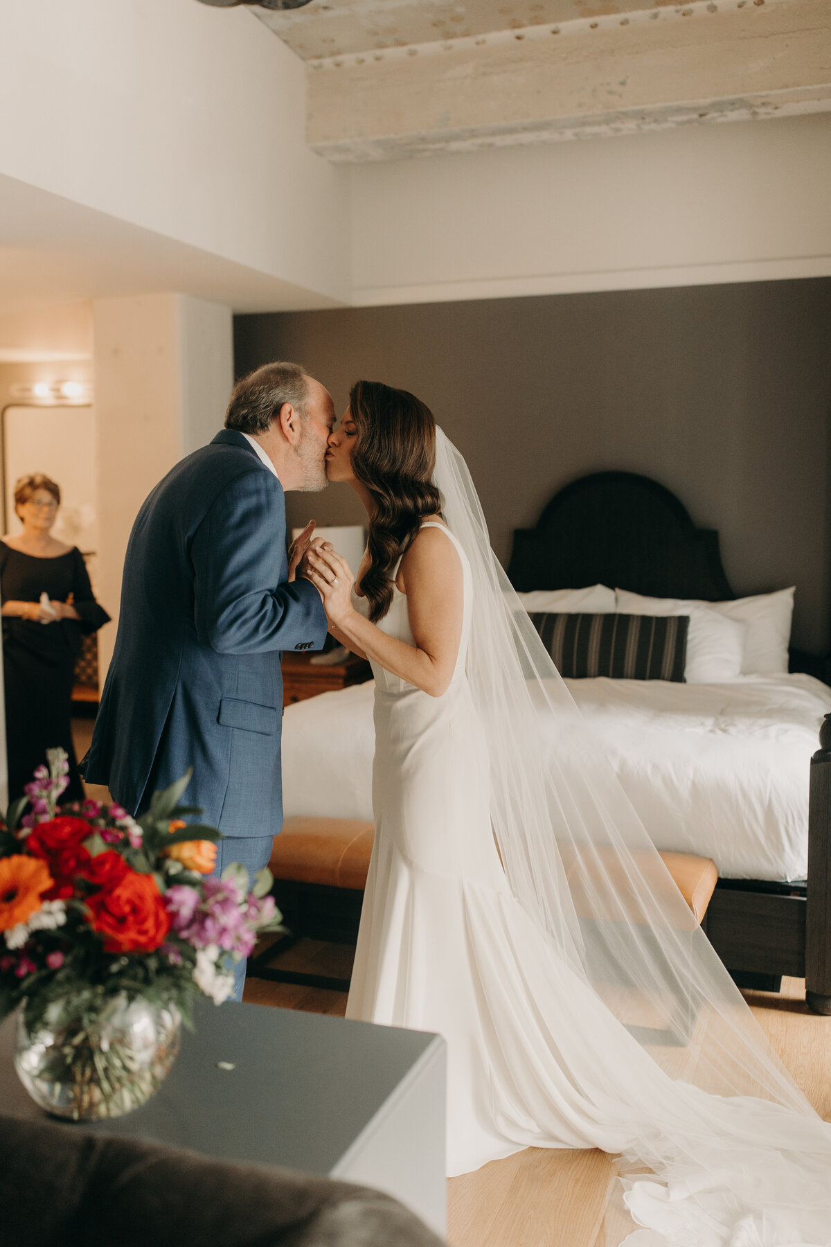 Bride and father sharing a kiss  during first look