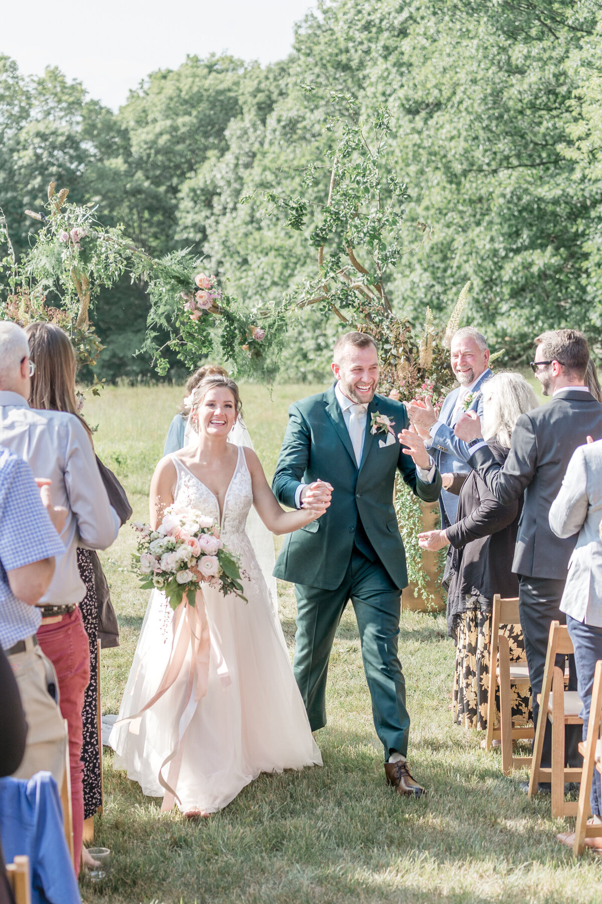 A joyous bride and groom m come back down down the aisle after saying  I  do