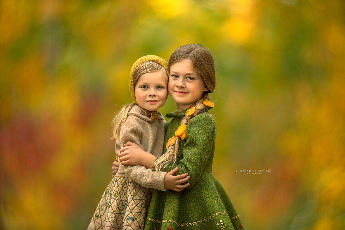 Girls hugging in autumn.