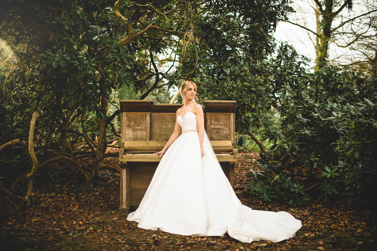 The bride stood by the piano at Iscoyd Park