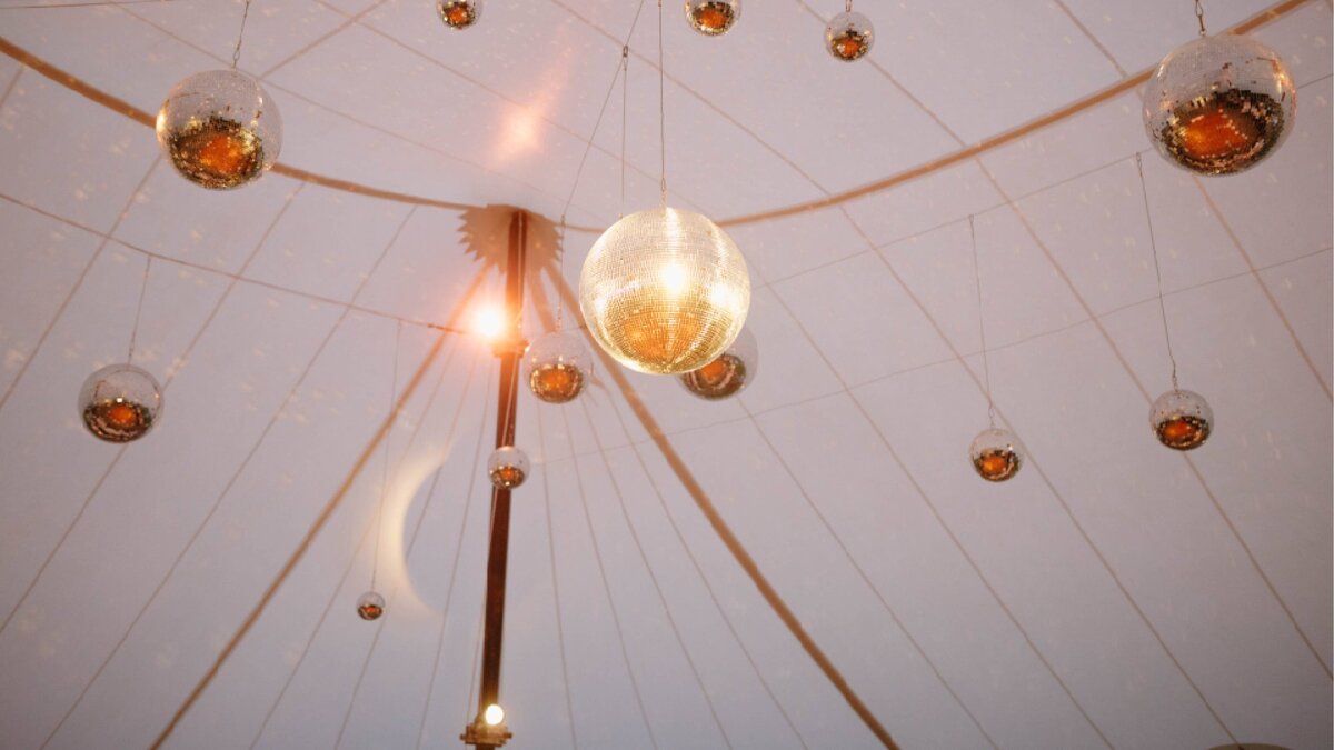 Elegant tented wedding reception with disco balls — Hoboken NJ event planning