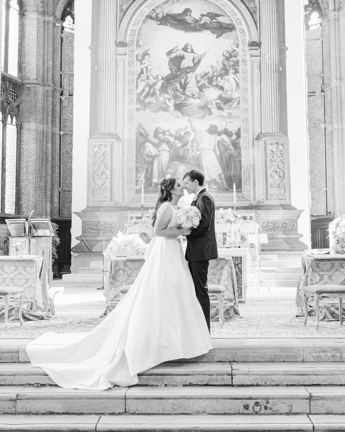 Bride and groom's first kiss in Venice wedding