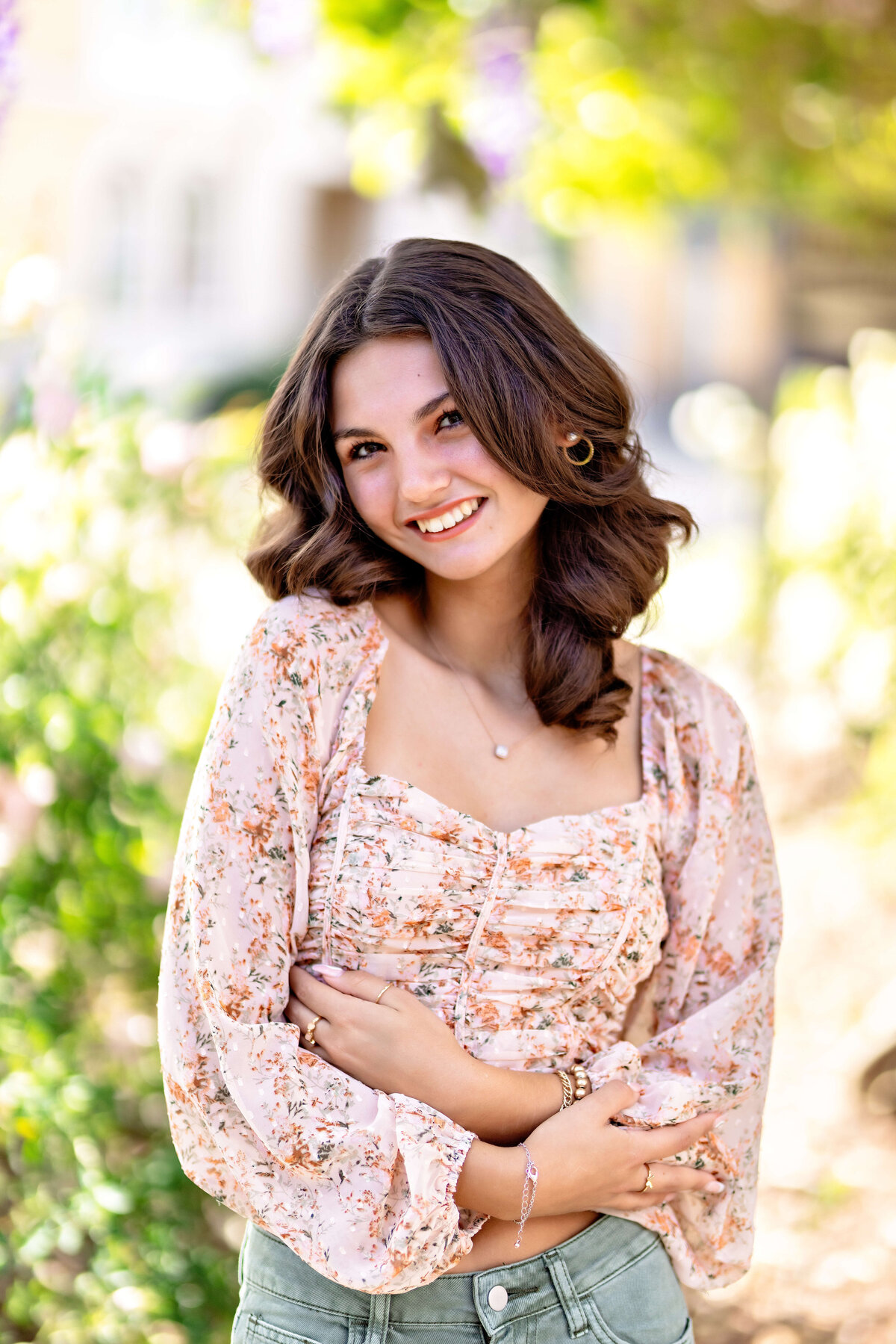Senior portrait close-up surrounded by florals during spring season in Orlando